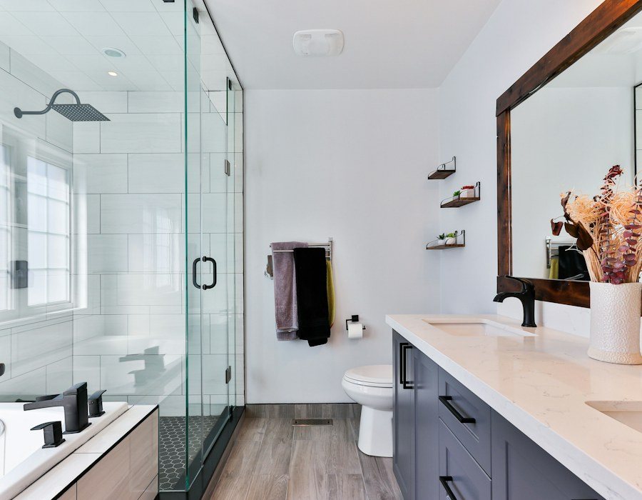 Bright modern bathroom with walk-in shower and vanity