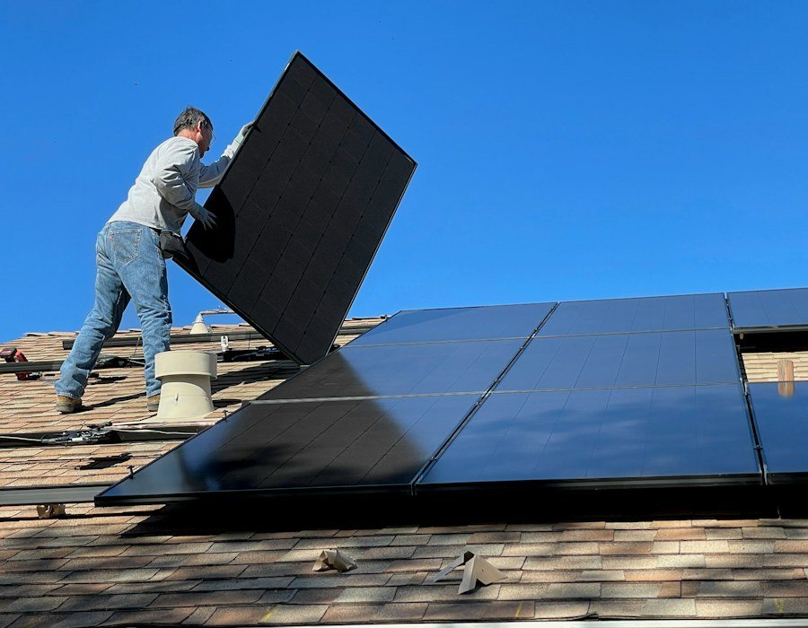 Solar panels being installed on a residential roof